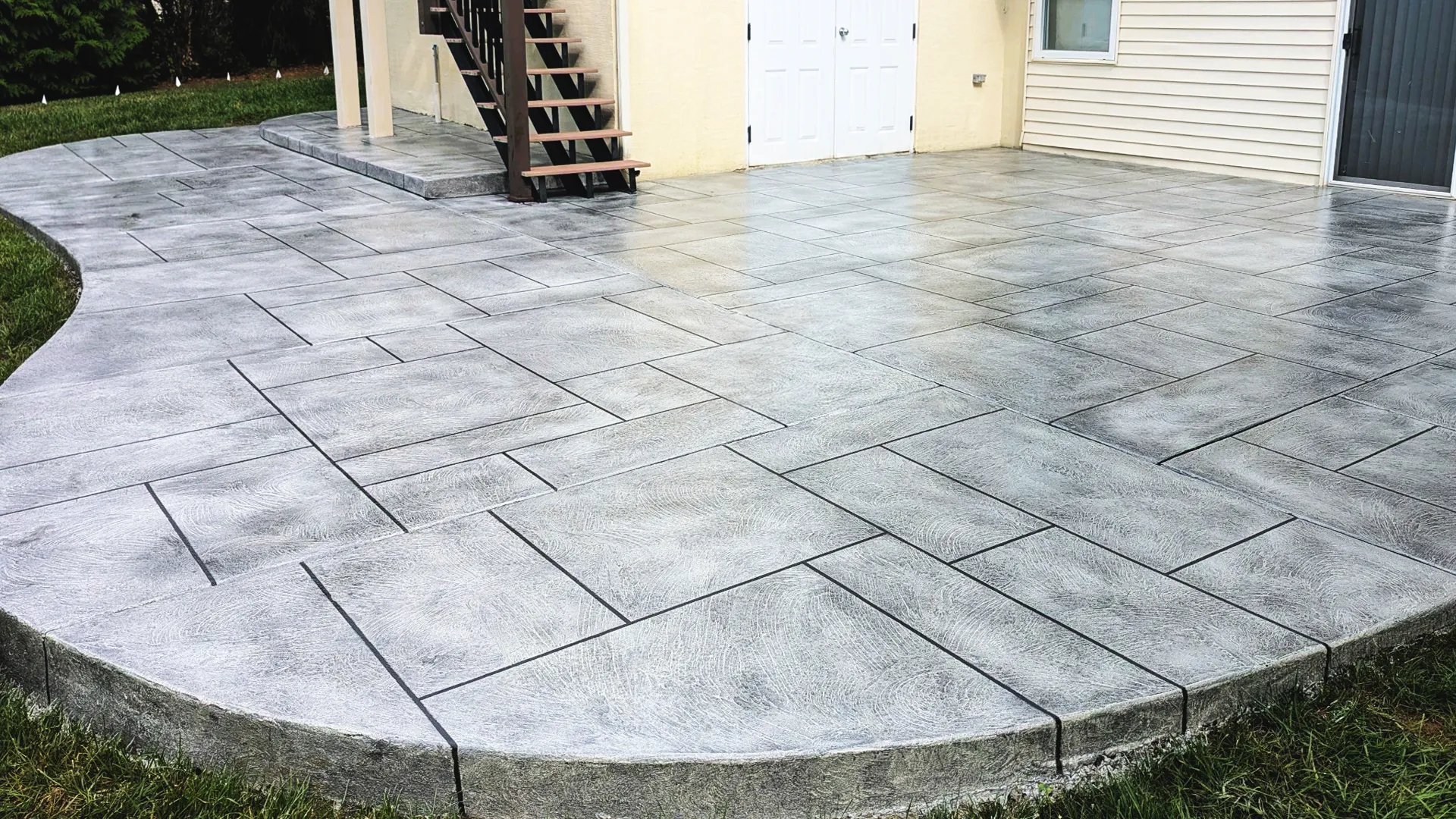 Textured tuscan slate decorative concrete patio with epoxy coating in Idaho