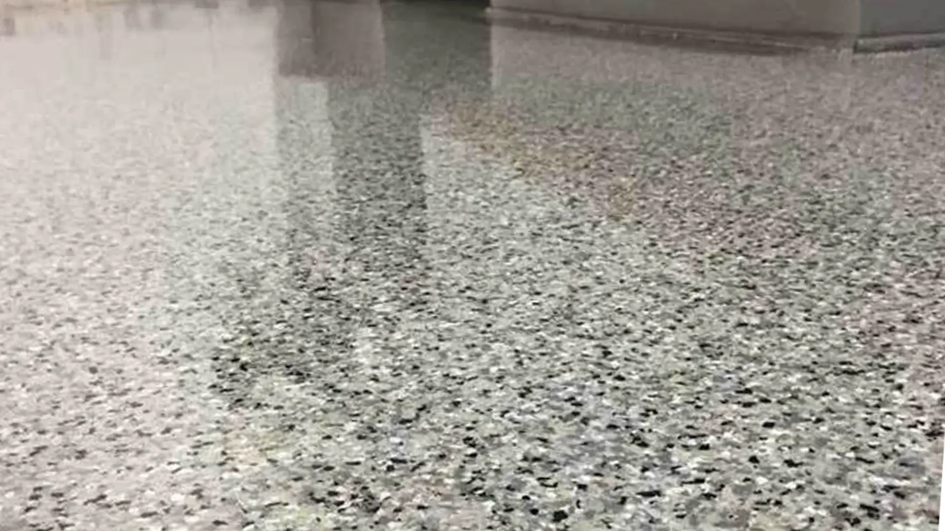 gray flake epoxy flooring in a finished basement in Idaho