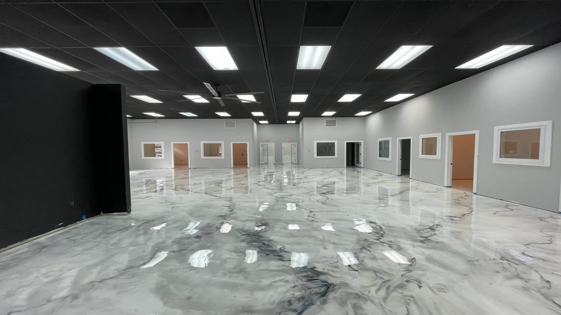 Metallic Marble epoxy flooring in an Idaho office by TVS Coatings with a modern, high-gloss white and gray marble finish