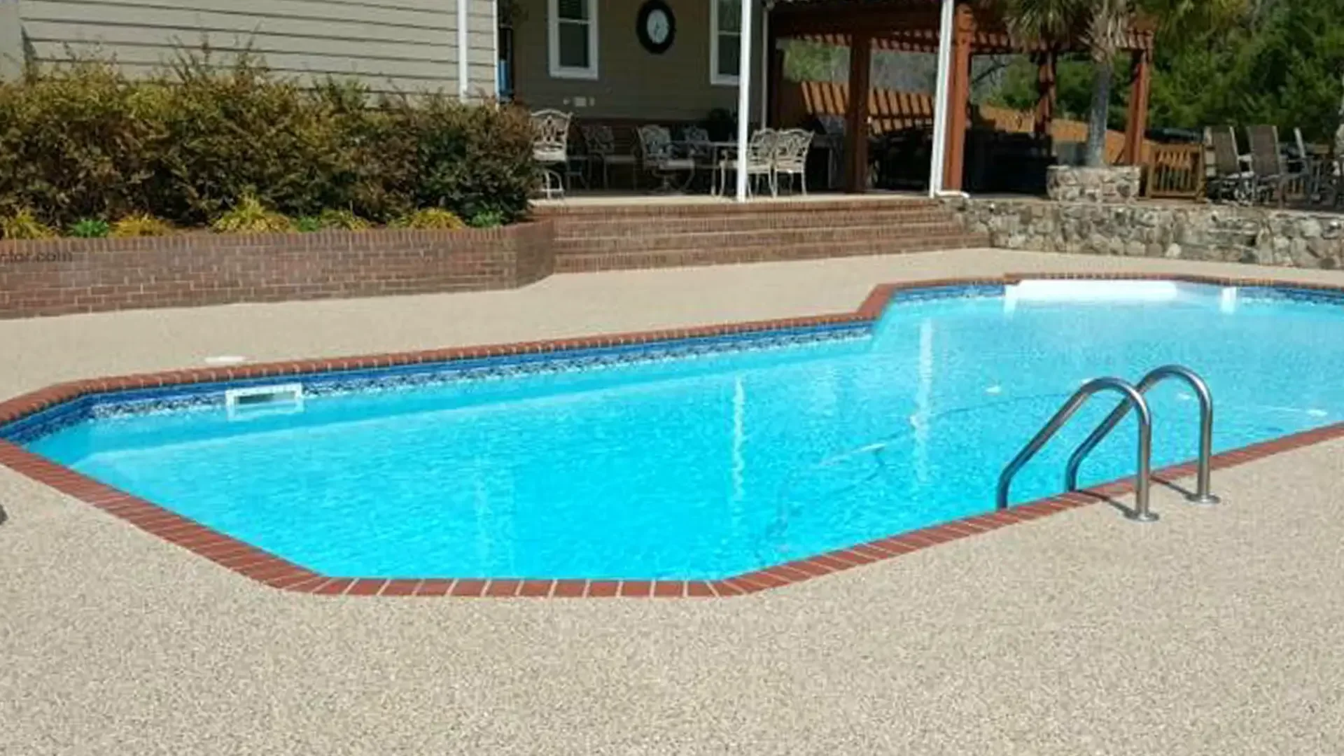 Graniflex epoxy flake pool deck coating by TVS Coatings in Idaho for slip-resistant outdoor epoxy flooring