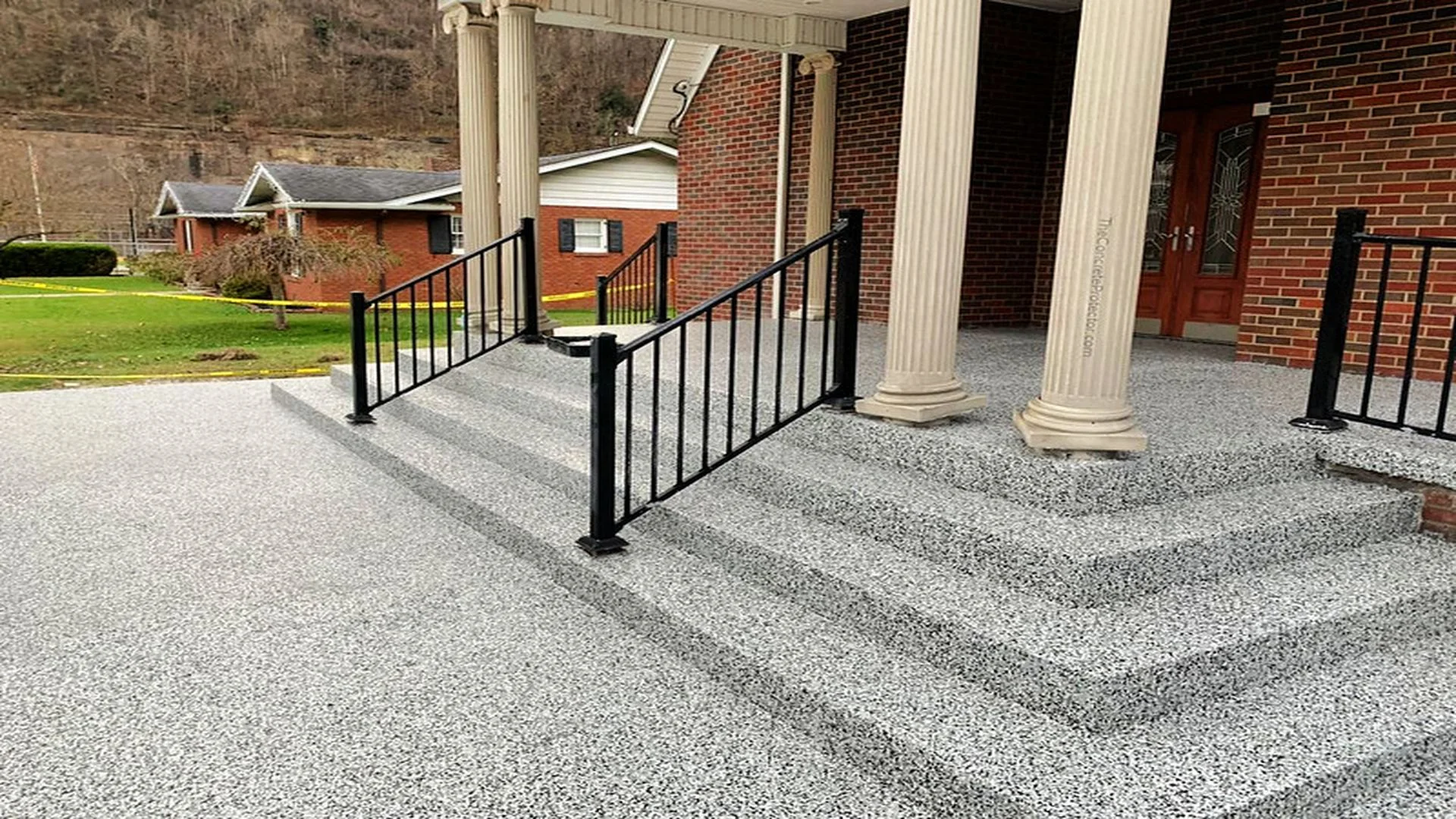 Graniflex epoxy flake coating on decorative concrete porch steps installed by TVS Coatings in Idaho