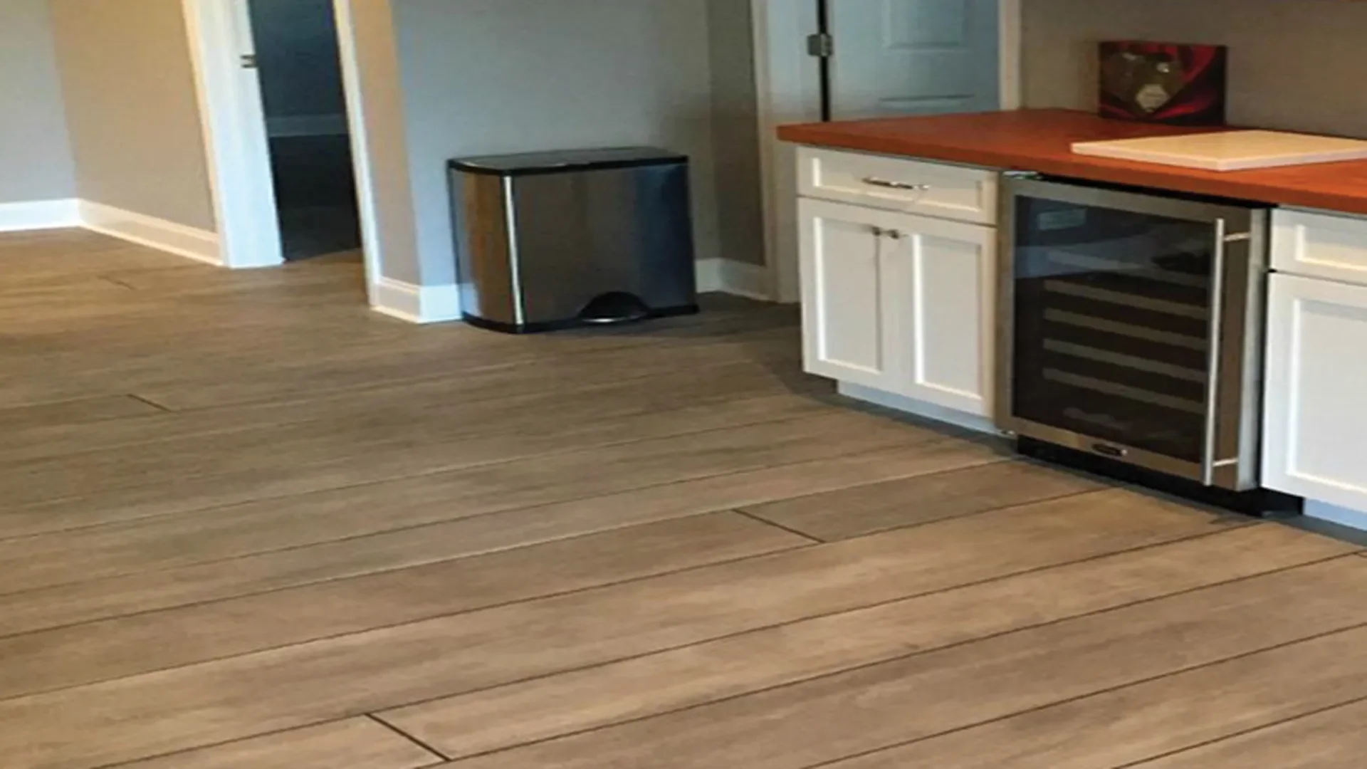 Rustic Concrete Wood epoxy flooring in an Idaho kitchen installed by TVS Coatings, mimicking the look of natural pine planks