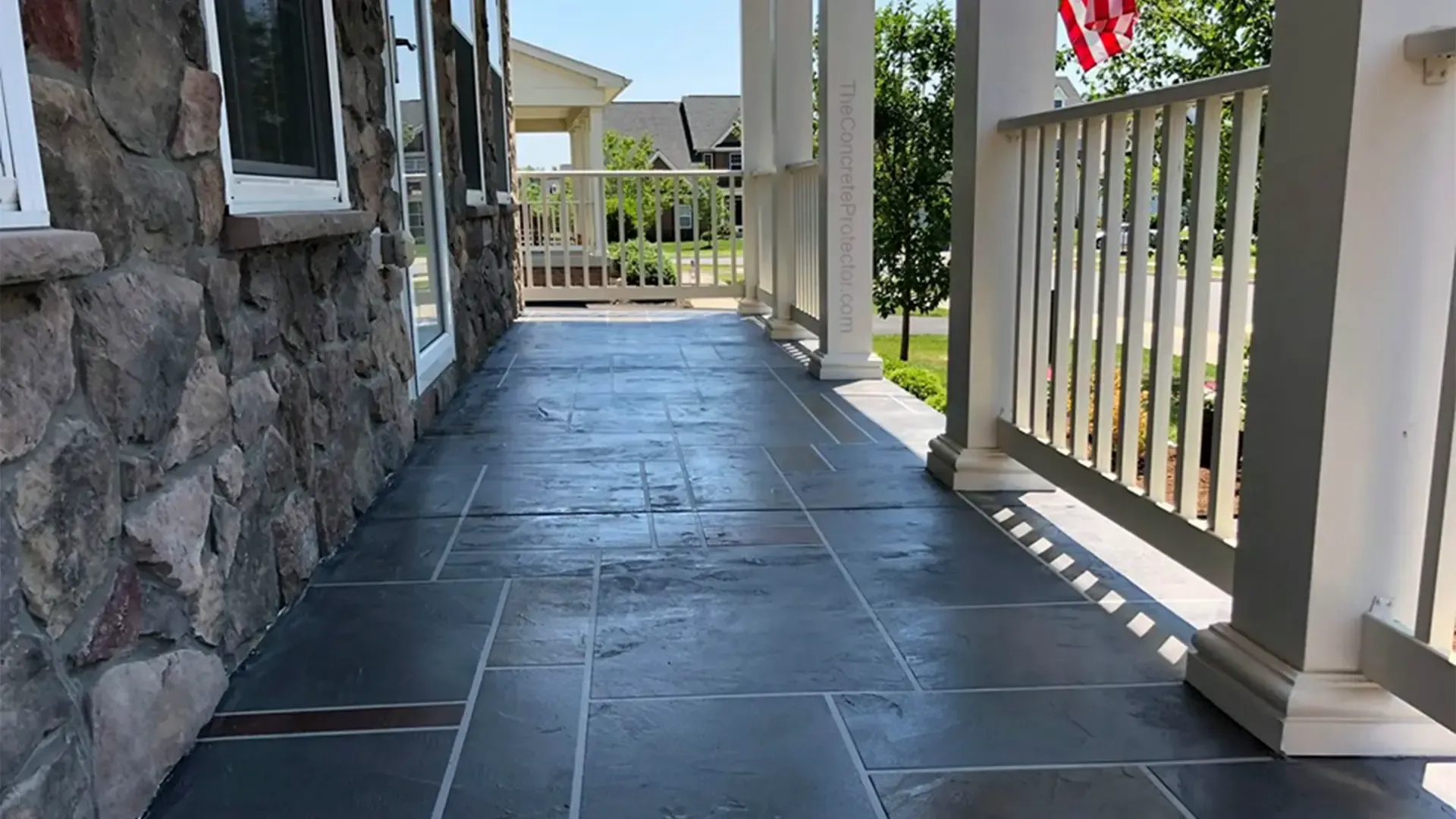 Epoxy flooring on a Tuscan slate porch in Idaho by TVS Coatings