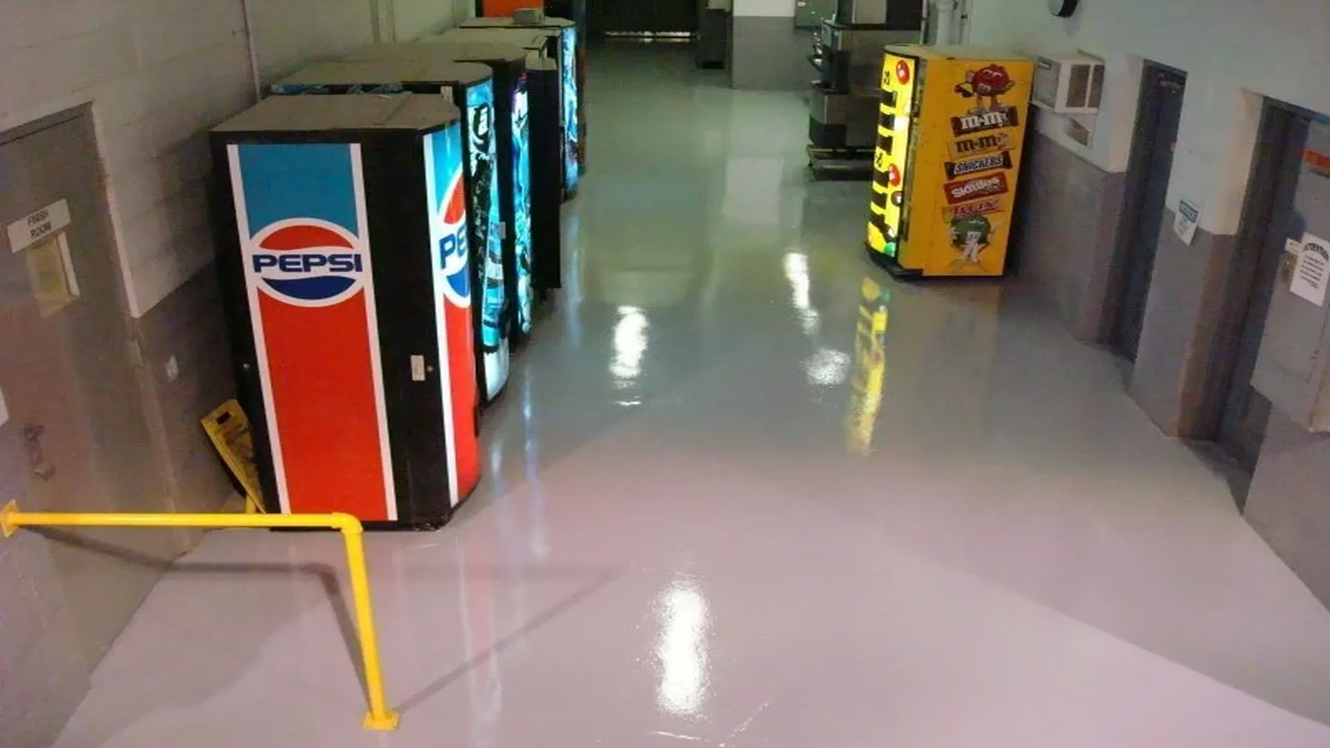Resinous epoxy flooring in a vending area with a reflective high-gloss finish by TVS Coatings, Idaho.