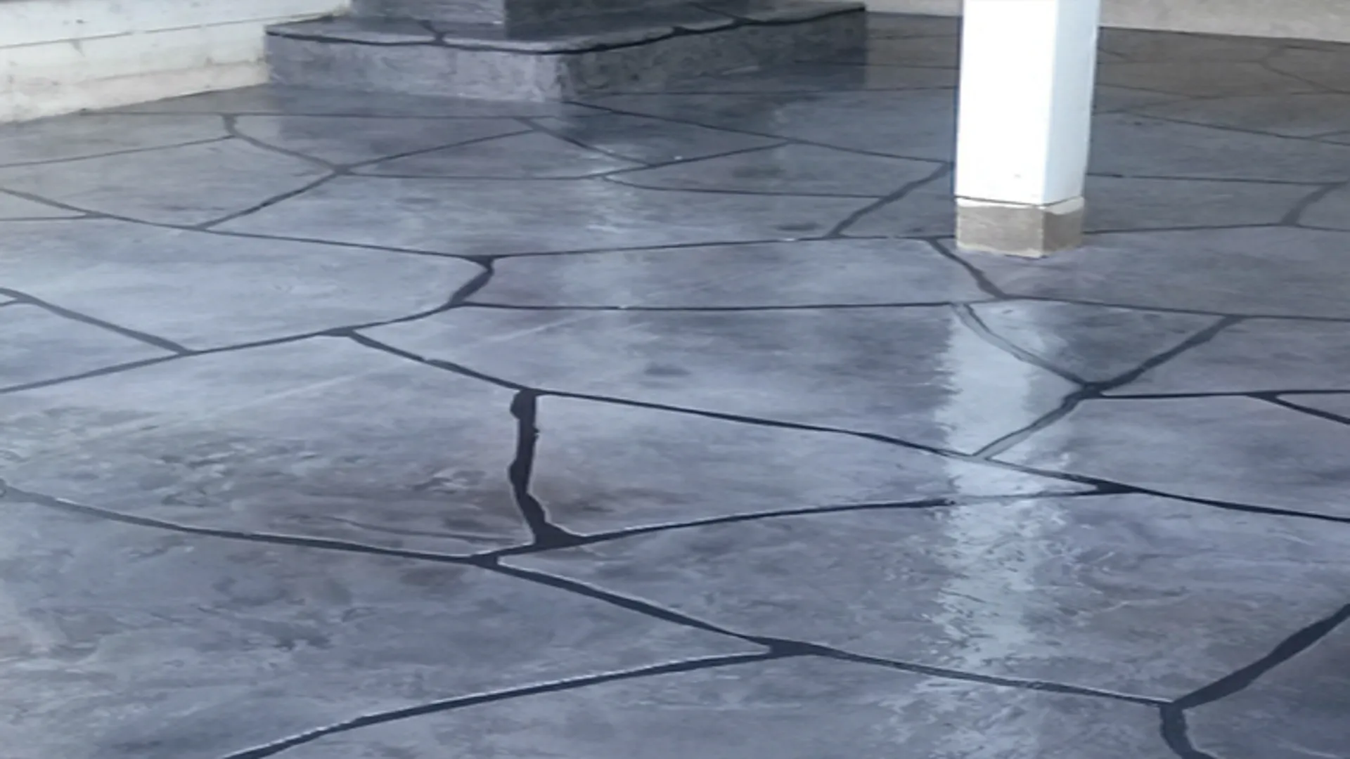 Decorative concrete grand flagstone patio with a glossy epoxy flooring finish in Idaho